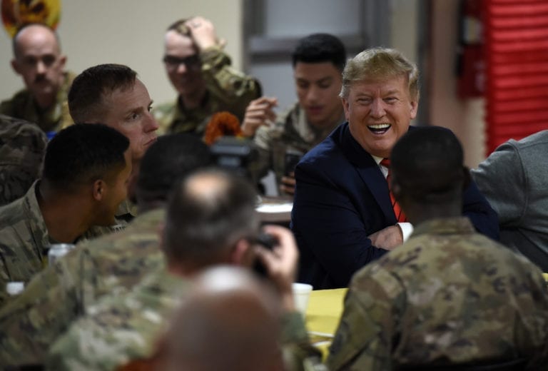 Trump makes an unannounced Thanksgiving visit to US troops in Afghanistan and serves up turkey dinners on his first trip to the country before announcing the resumption of talks with the Taliban